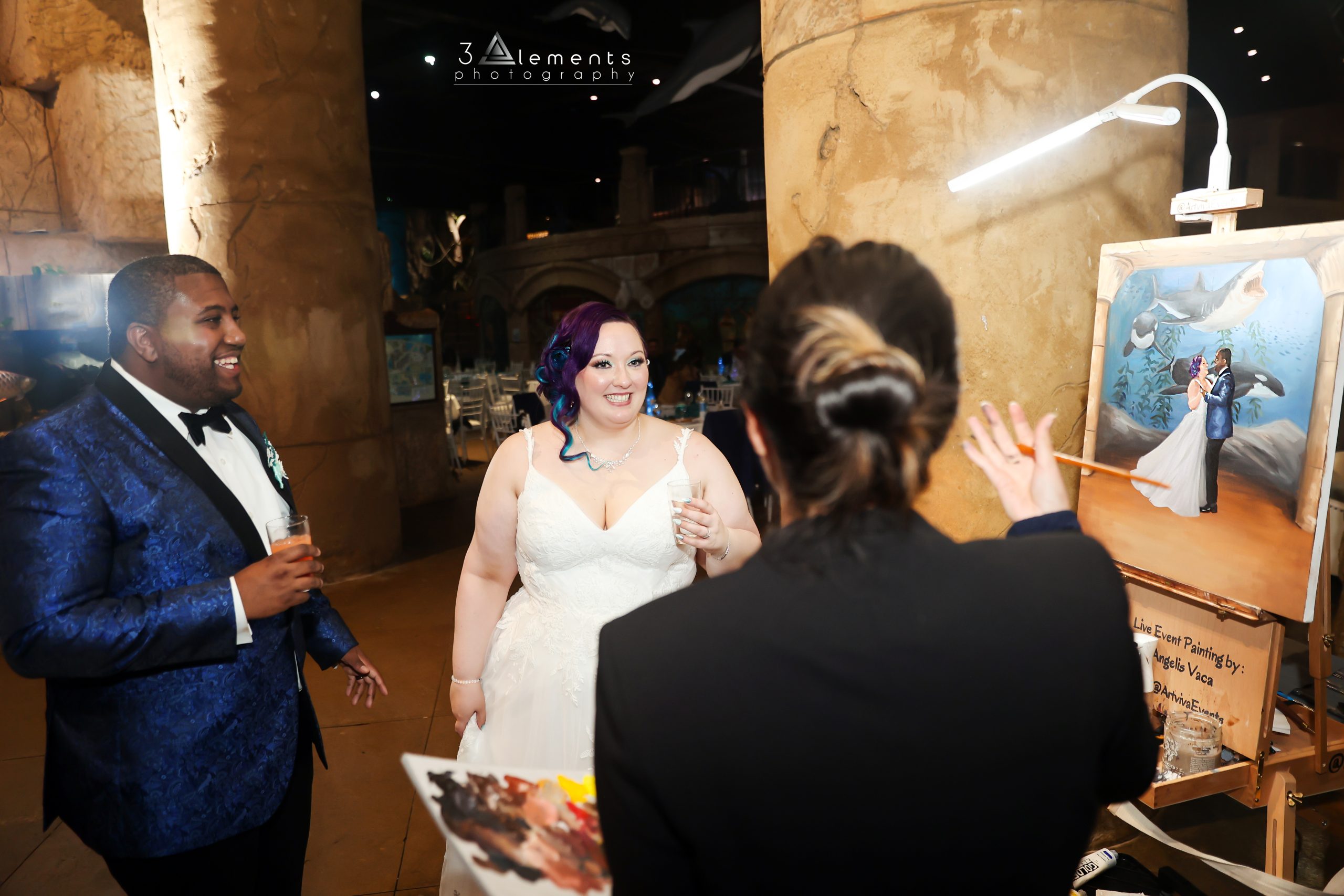Bride and groom with portrait painter
