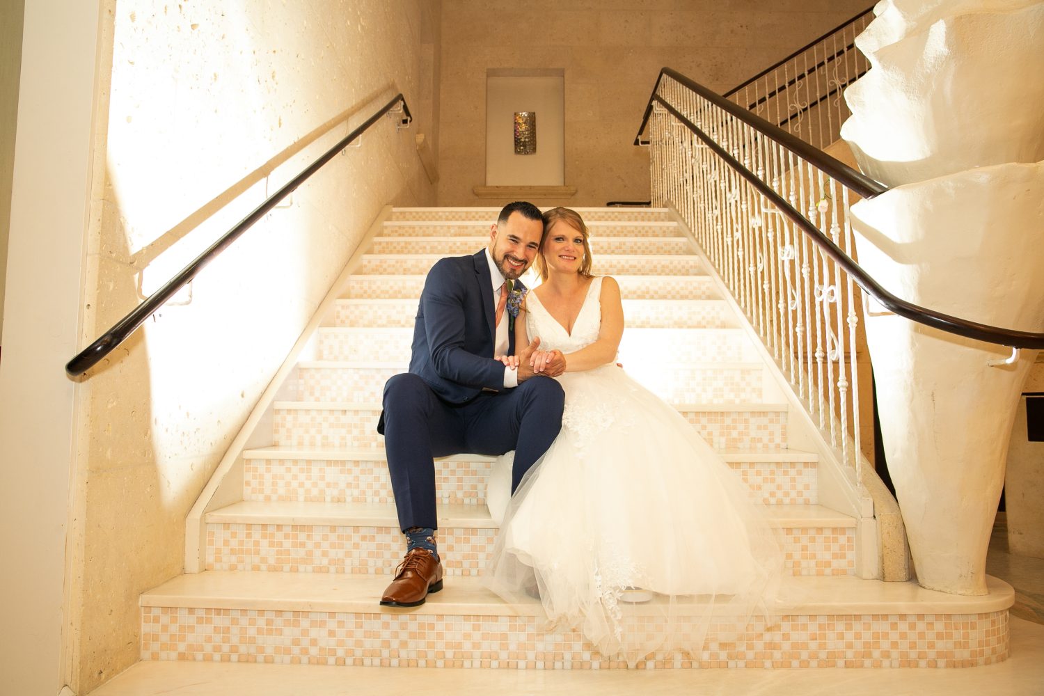 Bride and Groom on Marble Stairs