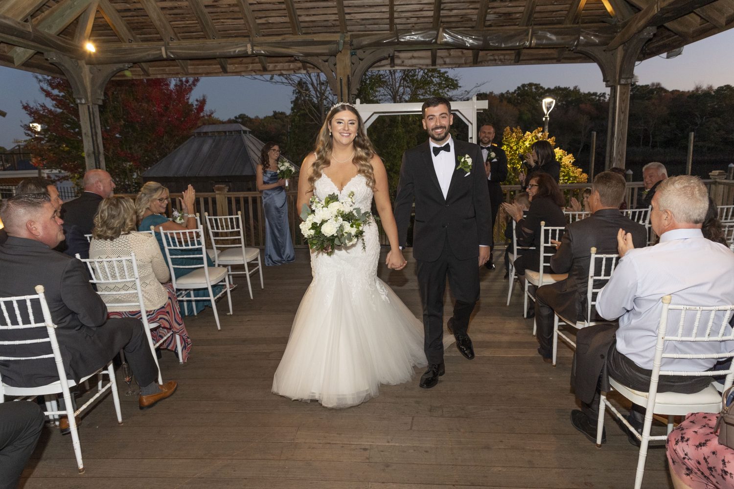Bride and groom walking up aisle after wedding ceremony