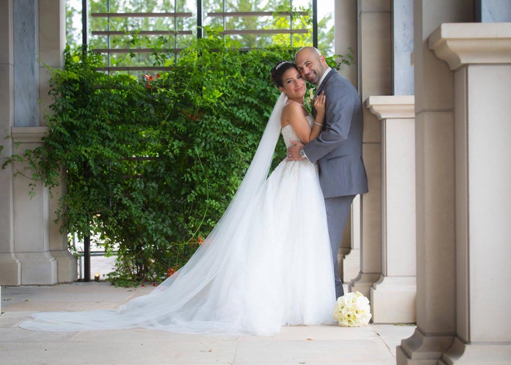 Bride and groom embracing outside the Sea Star Ballroom