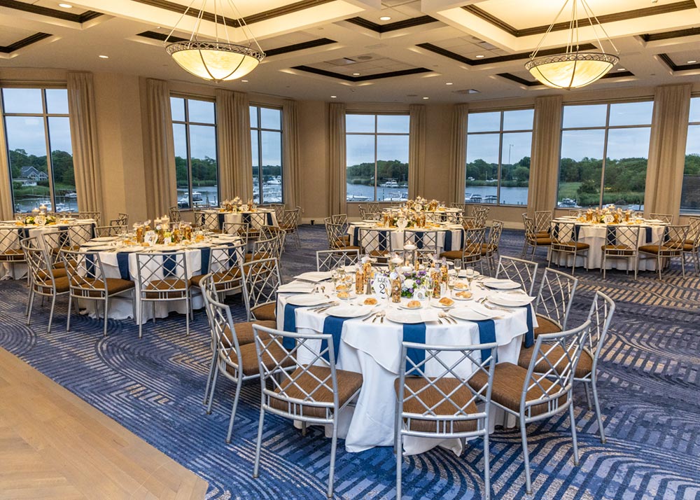 Sea Star Ballroom set with tables for a waterfront wedding reception