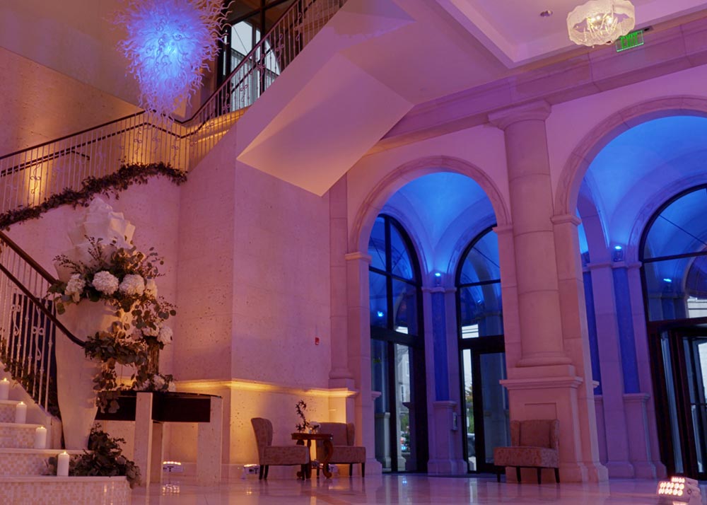 Sea Star Ballroom foyer with staircase and floral wedding decorations